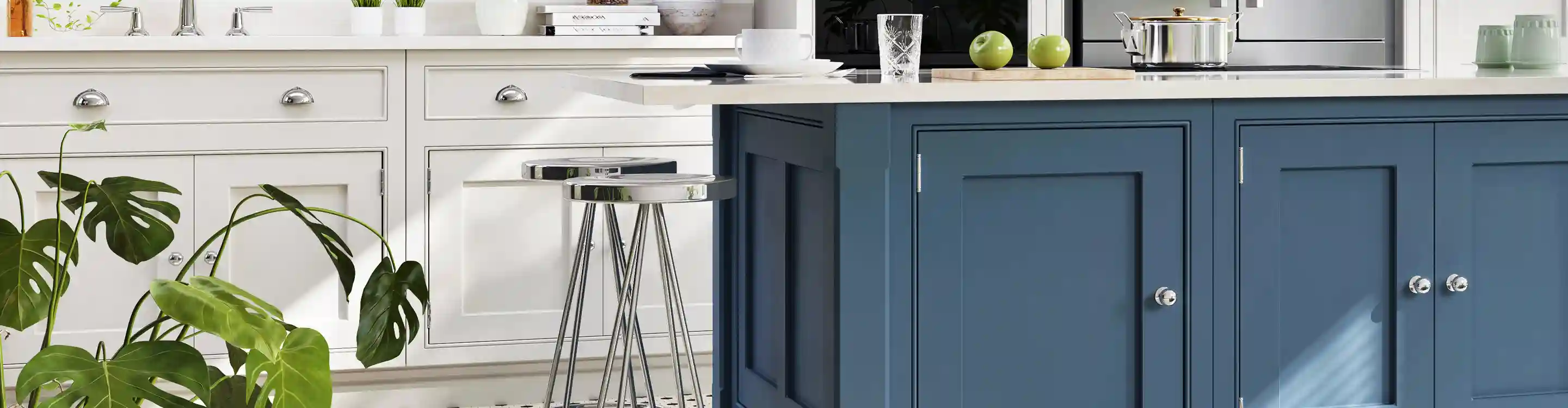 custom white and navy cabinets in kitchen with white stone countertop and mosaic tile backsplash