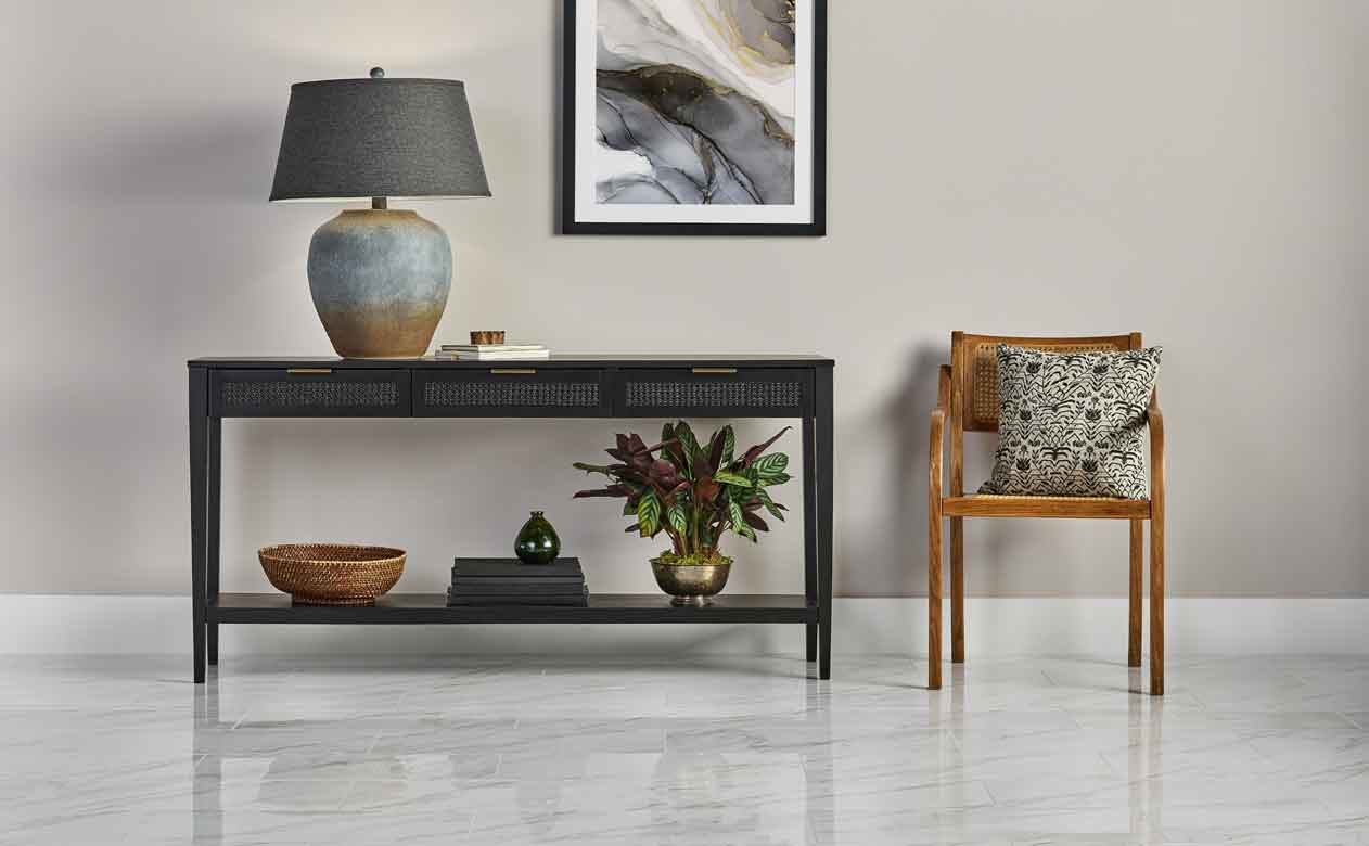 Living room in Louisiana with Woven Drawer Console Table Black and marble look tile flooring