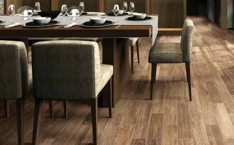 dark wood floors with green furniture